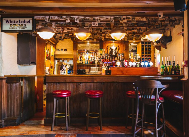 The Cock Tavern Swords back bar