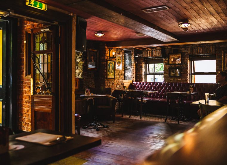 The Cock Tavern Swords font lounge left door